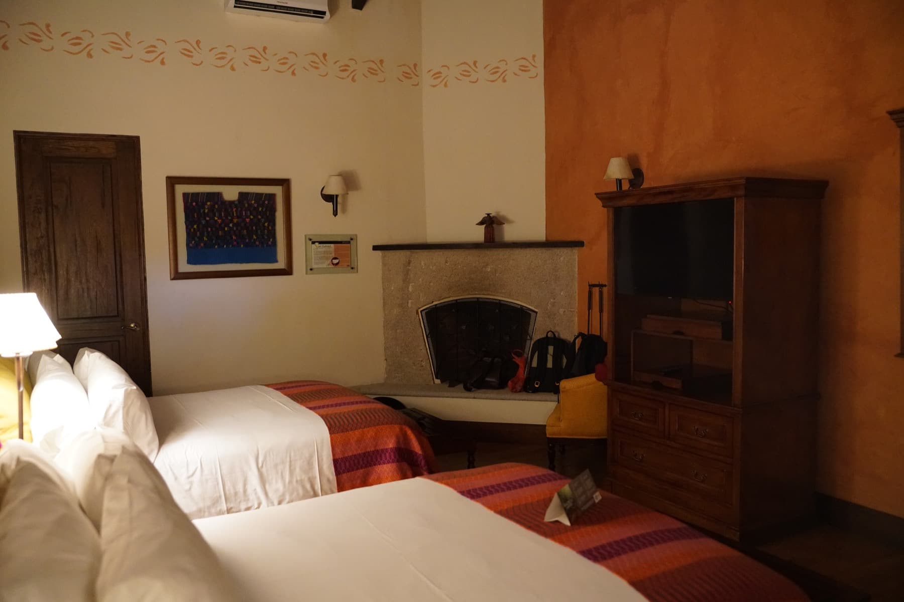 Illustrative photograph of a hotel room with two beds. Not a customer's property.