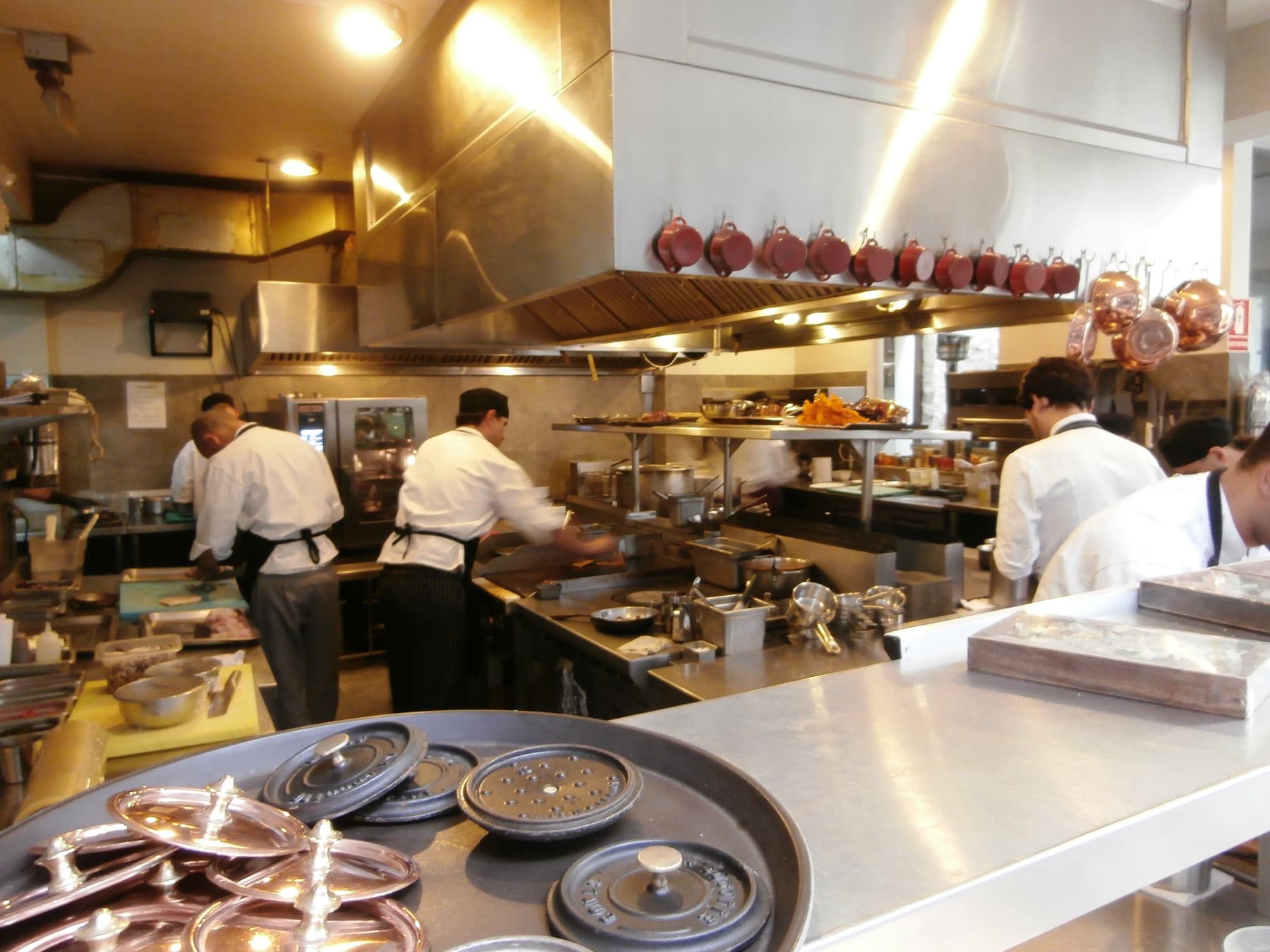 Illustrative photograph of cooks working a restaurant line. Not a customer's kitchen.